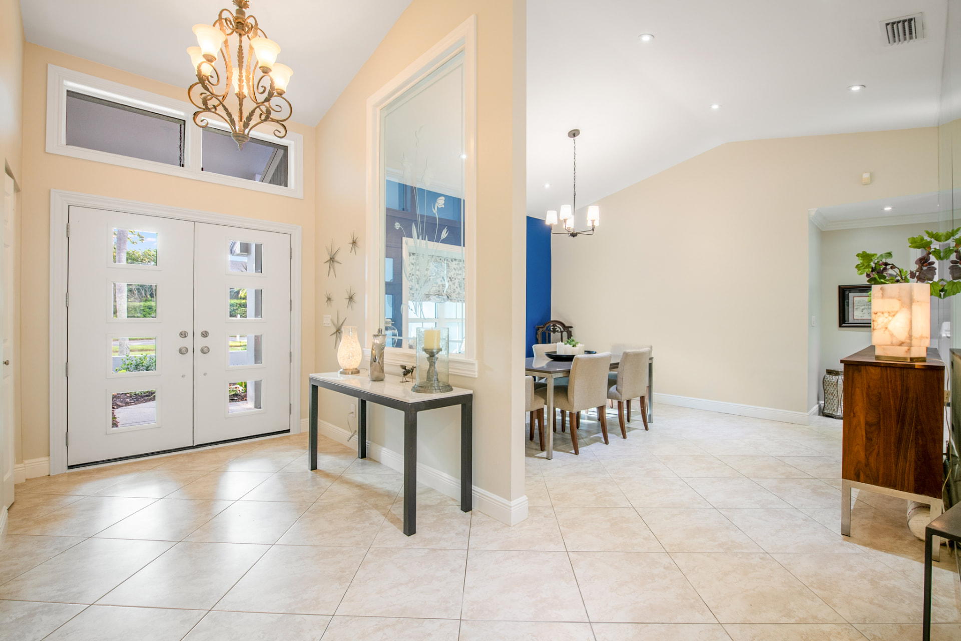 Foyer with double front doors and chandelier in a Palm Harbor, FL home