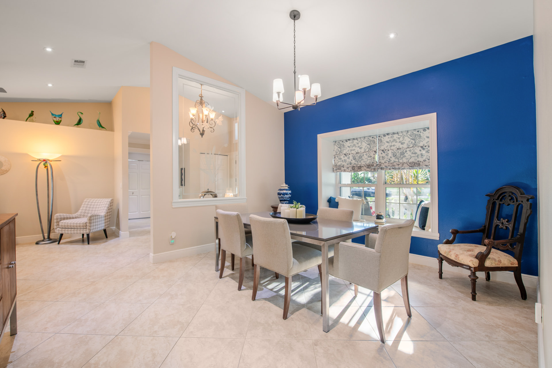 Dining room with blue accent wall in a Palm Harbor, FL home